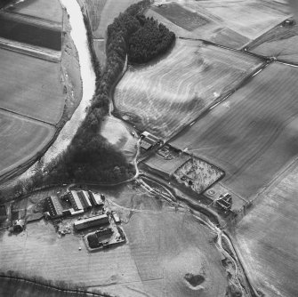 Oblique aerial view from NE, centred on Staplegordon old parish church and Barntalloch motte-and-bailey castle. Potholm farmsteading is visible in the bottom left-hand corner of the photograph.