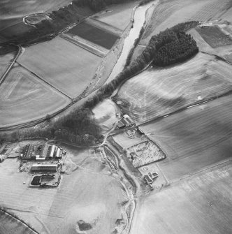 Oblique aerial view from NE, centred on Staplegordon old parish church and Barntalloch motte-and-bailey castle. Potholm farmsteading is visible in the bottom left-hand corner of the photograph.