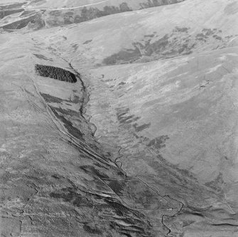 Oblique aerial view of Wrangway Burn centred on the remains of hollow-ways, a road, a possible Roman road and linear earthworks, taken from the SSW.