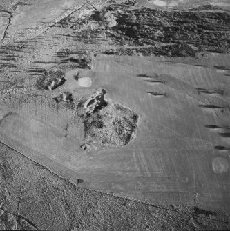 Oblique aerial view of Charlie's Sike centred on the remains of a settlement and quarries with boundary banks and rig adjacent, taken from the W.