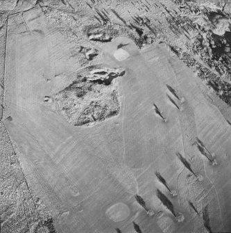 Oblique aerial view of Charlie's Sike centred on the remains of a settlement and quarries with boundary banks and rig adjacent, taken from the SW.