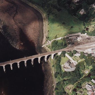 Oblique aerial view of Berwick-upon-Tweed centred on the Royal Border bridge and remains of the castle, taken from the SE.