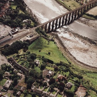 Oblique aerial view of Berwick-upon-Tweed centred on the Royal Border bridge and remains of the castle, taken from the NNW.