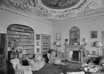 Interior view of Balcaskie House showing the library with fireplace.