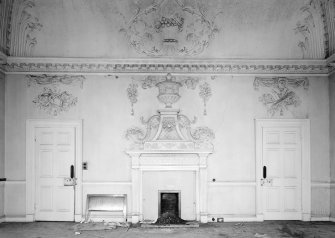 Interior view of Fullarton House showing second floor north room with plasterwork and fireplace.