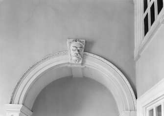 Interior view of Fullarton House showing detail of plasterwork above archway at top of staircase on second floor.