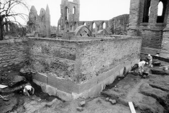 General view from NW of excavation around wall, Arbroath Abbey