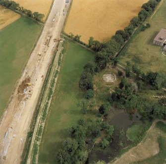 Oblique aerial view of the remains of Stoneyfield cairn.