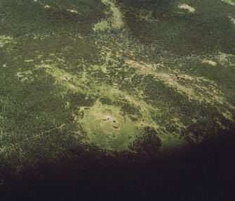 Oblique aerial view of the remains of a cairn at King's Seat.
