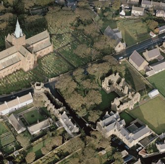 Oblique aerial view of St Magnus Cathedral, Earl's Palace and Bishop's Palace, Kirkwall.