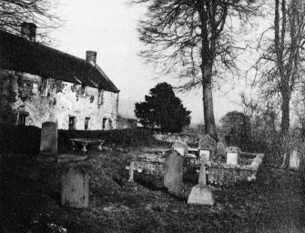 View of house and graveyard