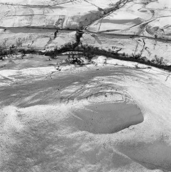 Oblique aerial view of the remains of Down Hill fort.