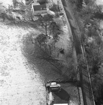 Oblique aerial view of Tulloch Knowe cairn
