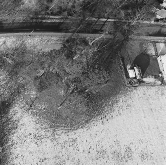 Oblique aerial view of Tulloch Knowe cairn
