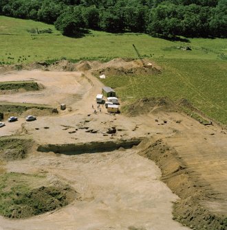 Oblique aerial view showing the excavation at the site at Dalladies.