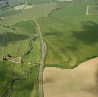 Oblique aerial view of the cropmarks of East Renton Mill settlement and linear cropmarks.
