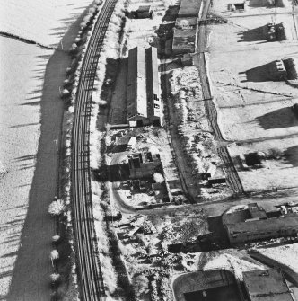 Bowhouse armament depot and factory, oblique aerial view, centred on loading warehouses.