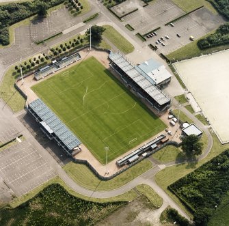 Oblique aerial view centred on the football ground, taken from the NE.