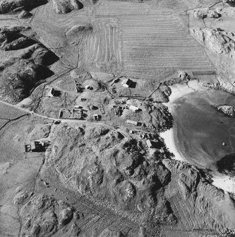 Oblique aerial view of Sorisdale, taken from the south, centred on the cottages.