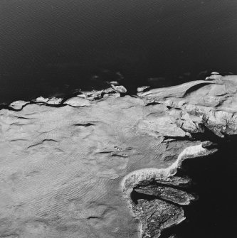 Oblique aerial view of Staffa, taken from the north west, centred on building remains.