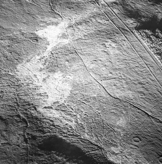 Tormore, oblique aerial view, taken from the SSW, centred on two hut-circles. Further hut-circles are visible in the bottom right-hand corner of the photograph.