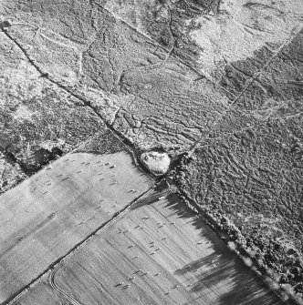 Moss Farm Road, oblique aerial view, taken from the NNW, centred on the cairn.