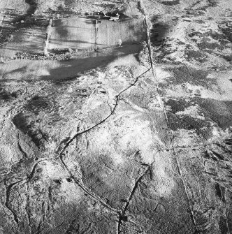 Moss Farm, oblique aerial view, centred on a hut-circle and enclosure.