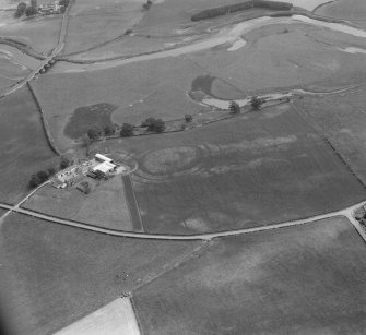 Oblique aerial view of the cropmarks of a fort at Greenhillhead.