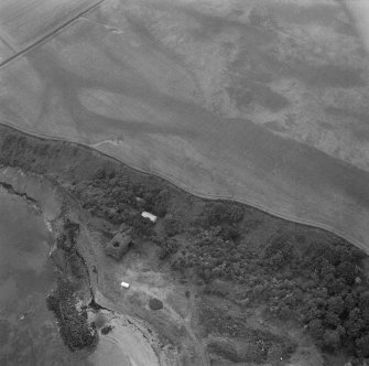 Oblique aerial photograph from northwest of limekiln and part of quarry.