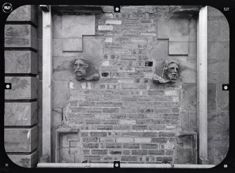 View of remains of swag showing heads, Mavisbank House.