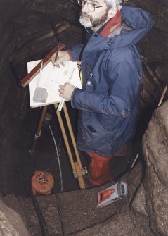 Commission at work: Mr I Parker carrying out plane table survey in the cistern (lower chamber).