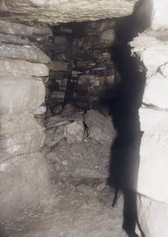 View along the lower and smaller of two side galleries opening out from the half landing.