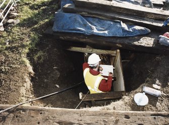 Commission at work: Mr I Parker at work in the entrance to the subterranean structure.