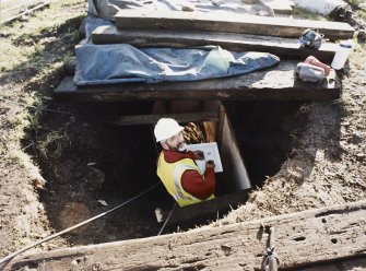 Commission at work: Mr I Parker at work in the entrance to the subterranean structure.