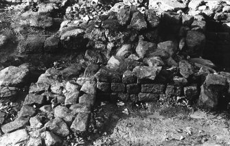 Excavation photograph : stoke hole passage from south, room 2.