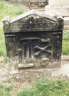 Tulliallan, Old Parish Church, burial ground.
General view of gravestone with hourglass, crossed bones, skull, and chisel, hammer and pick, below pediment.
Insc: '1767. R (loveheart) ITT (loveheart) I.R'