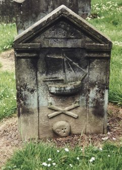 Tulliallan, Old Parish Church, burial ground.
General view of gravestone with simple pilasters and pediment with large sailing ship, crossed bones and skull beneath.
Insc: '1782'
