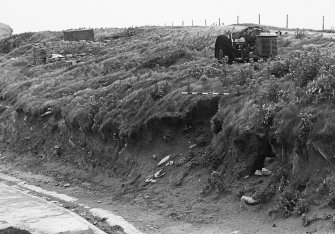 General view of side of slipway road to shore.