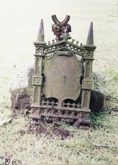 Detail of cast iron headstone.