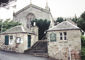 View of church and offertory houses from W.