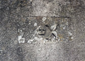 View of grave slab mounted on wall.