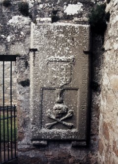 View of grave slab mounted on wall.