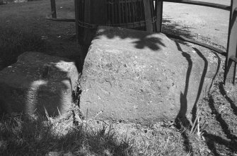Photograph of broken standing stone in Rhynie Square.