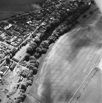 Milton and Friockheim, oblique aerial view, taken from the NE, centred on the cropmarks of a pit-defined cursus, pit-alignments and pits.