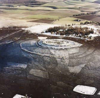 Oblique aerial view of White Caterthun centred on the remains of a fort, taken from the NW.