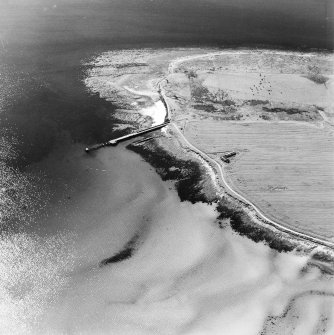 Oblique aerial view of Orkney, Swanbister House, First World War seaplane base, taken from the N.  Visible is the Royal Navy aircraft loading pier and former landing strip area.