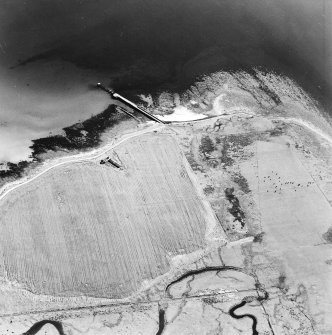 Oblique aerial view of Orkney, Swanbister House, First World War seaplane base, taken from the W.  Visible is the Royal Navy aircraft loading pier and former landing strip area.