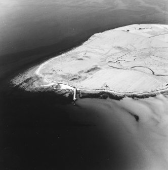 Oblique aerial view of Orkney, Swanbister House, part of the First World War seaplane base, taken from the NE.  Visible is the Royal Navy aircraft loading pier and former landing strip area.  Also visible is the Second World War radio mast base.