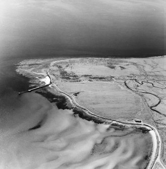 Oblique aerial view of Orkney, Swanbister House, part of the First World War seaplane base, taken from the N.  Visible is the Royal Navy aircraft loading pier and former landing strip area.