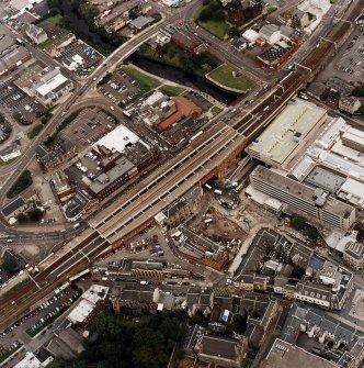 General oblique aerial view of Paisley centred on the railway station, taken from the SW.